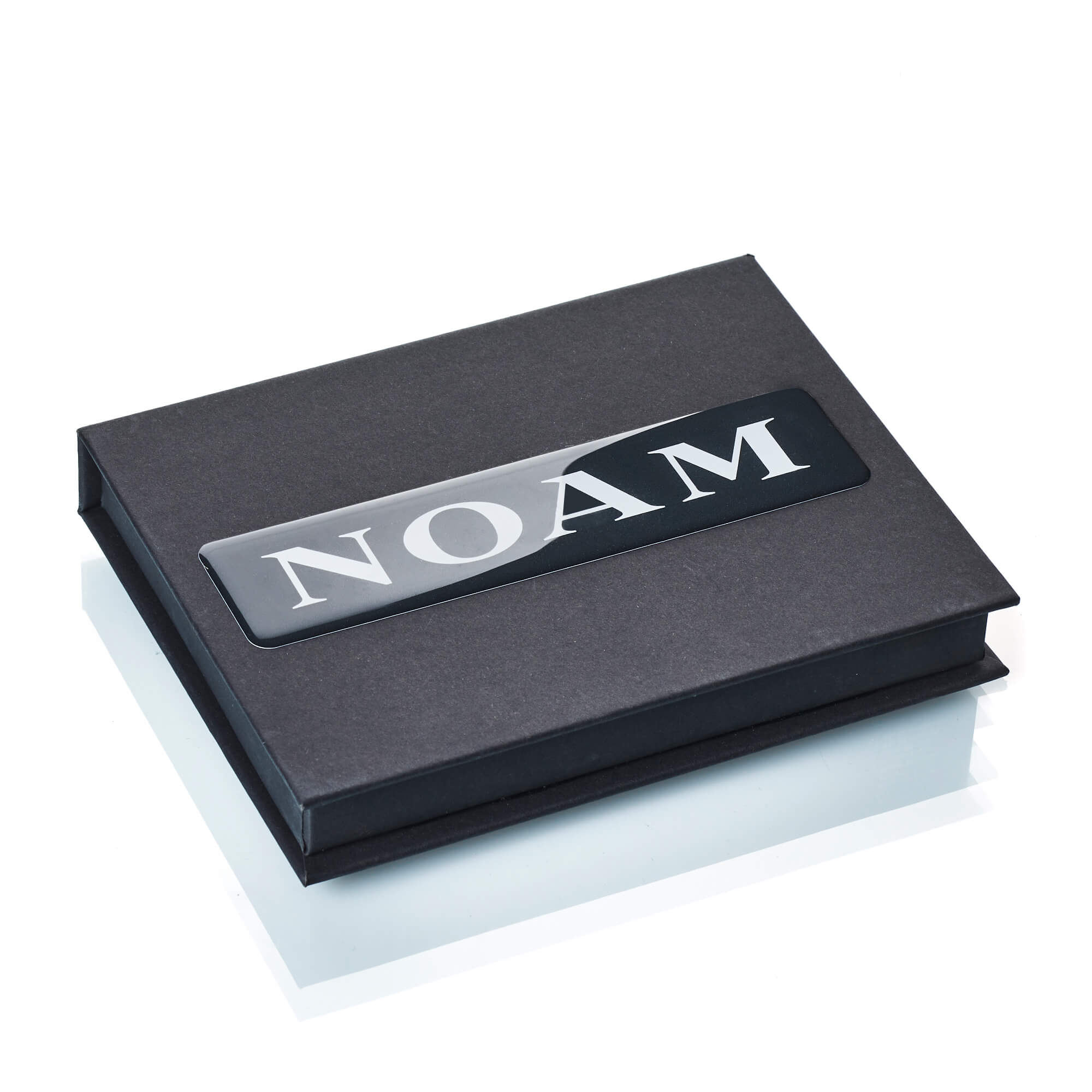 Image of the NOAM gift card from the top in a closed package