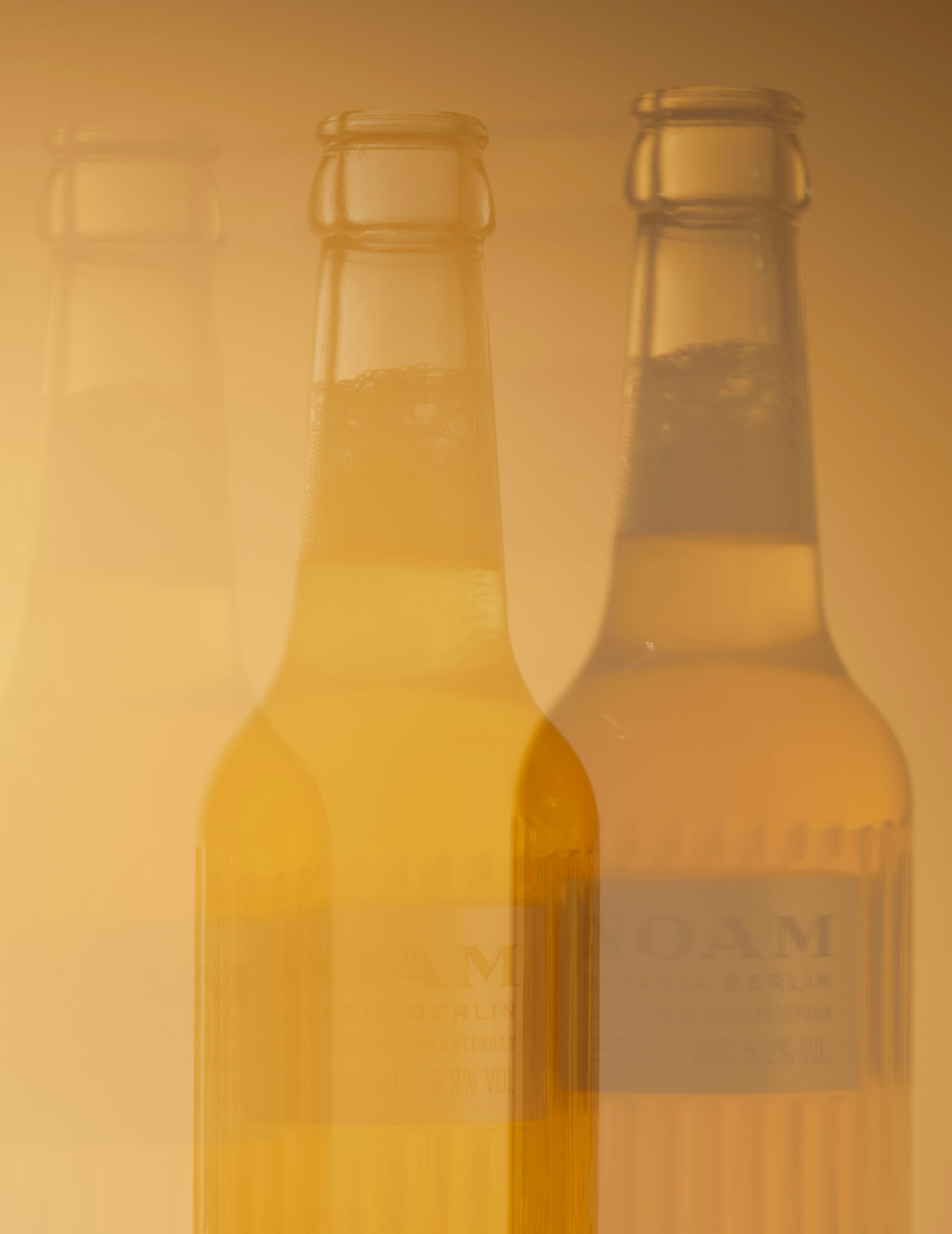 NOAM Lager Beer blurry with a golden-beige background - mobile image